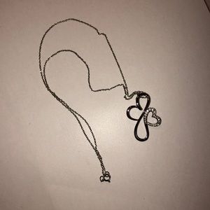 Woman Silver and Dimond Cross w Heart